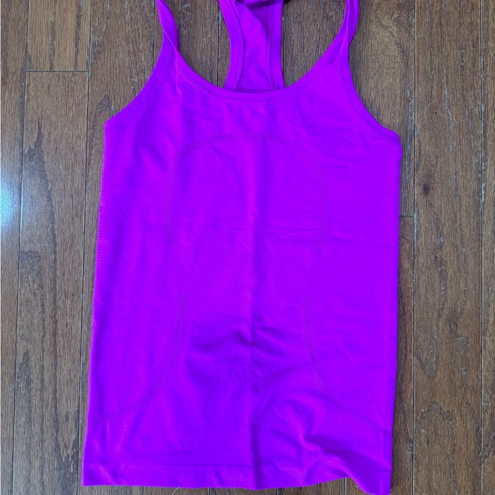 Gently worn women’s Lululemon Magenta Swiftly Tech Tank Top Size 4